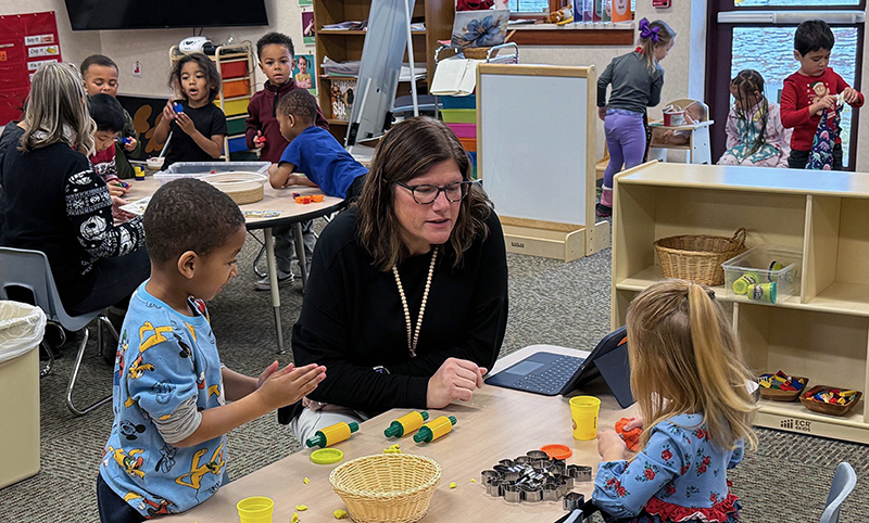 Image of Pre K classroom with teacher and students
